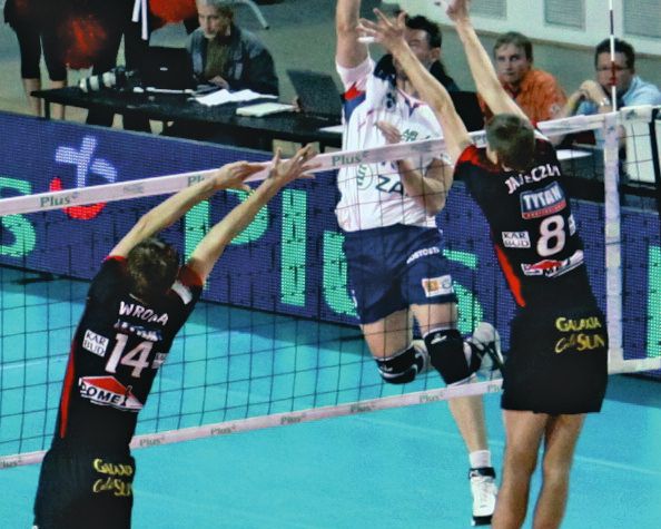 Volleyball-Wettkampfnetz - 3 mm PP - Maschenweite 10 cm - Höhe 1,00 m, Länge 9,50 m - schwarz - 4-Punkt-Befestigung, Stahlseil 11,70 m - 7 cm breites weißes Band oben, 5 cm breites weißes Band unten